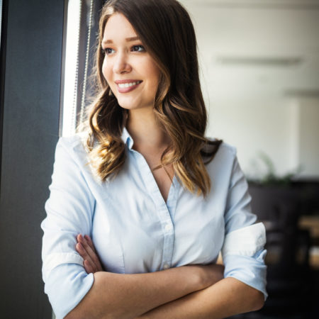 Successful business woman looking confident and smiling