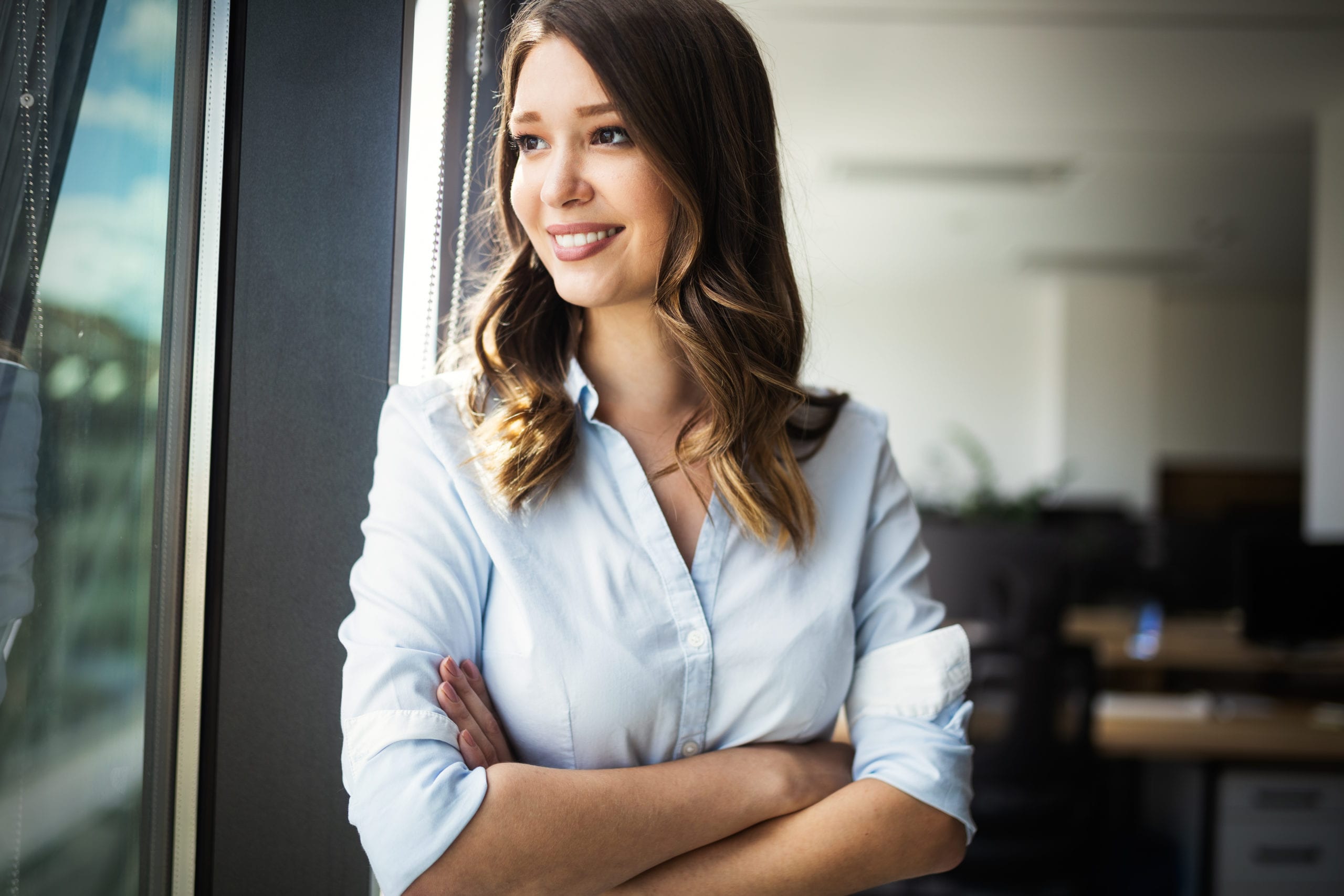 Successful business woman looking confident and smiling